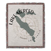 Woven blanket with Lake Merced map, compass rose, and California text.