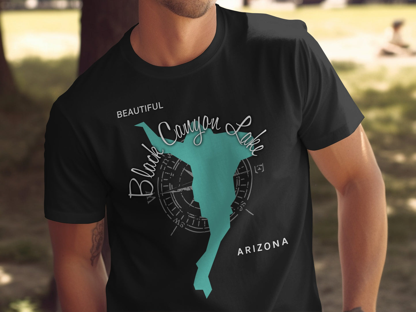 Black Canyon Lake Arizona graphic on a black t-shirt worn by a person.