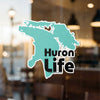 Turquoise Michigan shape with "Huron Life" text and copyright information.