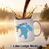 White mug with "Lake Huron Ontario" map design, coffee pouring into it.