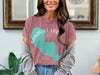 Pink t-shirt with teal Sandhill Lake graphic and "Wisconsin" text.
