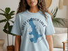 Light blue t-shirt with blue West Okoboji Lake map over compass graphic.