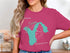 Teal outline of Washington State on a raspberry t-shirt with "Lake Union" and "Beautiful Washington" text.