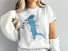 White t-shirt with blue Lynx Lake shape and compass design.