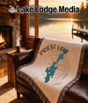 Woven blanket with Priest Lake Idaho map and compass design.