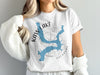 White t-shirt with blue Kaw Lake, Oklahoma map graphic and compass rose.