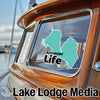 Teal lake outline sticker on a boat window with "Almanor Life" text.