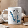 White mug with blue Walloon Lake map, compass, and text.