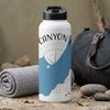 White water bottle with black lid and "CANYON" text over desert landscape graphic.