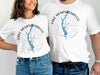 White t-shirts with Lake Memphremagog, Vermont map on compass design.