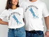 White t-shirts with "Lake Berryessa California" map and compass design.