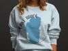 Light blue sweatshirt with Lake Tahoe outline and compass design.