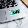 Manasquan Life sticker on a laptop computer.