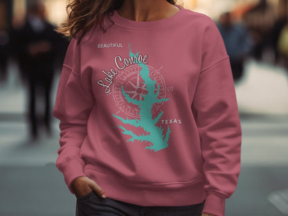 Teal Lake Conroe Texas compass rose graphic on maroon sweatshirt.