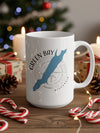 White mug with Green Bay Wisconsin design and compass graphic.