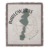 Barlow Lake Michigan outline over compass rose on woven blanket.