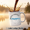White mug with "North Channel Ontario" and a compass, with coffee pouring into it.
