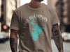 Tan t-shirt featuring a turquoise outline map of Lake Buchanan, Texas