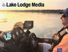 Boat dashboard and person with "Lake Lodge Media" and "martin Life" logos at sunset.