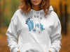 White hoodie with Marco Island, Florida compass graphic and outline.