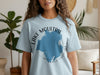 Light blue t-shirt with "Lake Moultrie South Carolina" text and abstract blue shape.