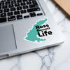 Turquoise map sticker with "Ross Barnett Life" text on a laptop