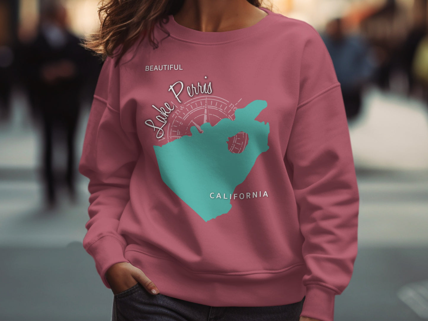 Pink sweatshirt with "Lake Perris California" map graphic and compass rose.
