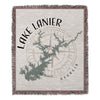 Woven blanket with Lake Lanier map graphic and compass, in black and beige.