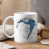 White mug with "Rushford Lake New York" text, lake shape, and compass rose.