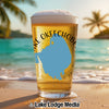 Beer glass on beach with "Lake Okeechobee" text and Florida map graphic.