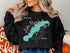 Black sweatshirt with Lake Marble Falls Texas map and compass graphic.