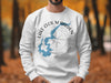 White crewneck sweatshirt with Lake Cecil M Harden Indiana map and compass design.