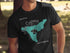 Black t-shirt with a teal graphic of Lake Cuyamaca and compass rose.