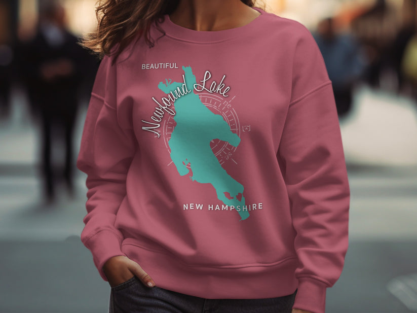 Pink sweatshirt with "Beautiful Newfound Lake New Hampshire" and a compass rose.