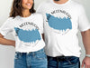 White t-shirts with "Lake McConaughy Nebraska" map graphic and compass details.