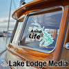 Sticker on a boat window with "Anna Life" logo and a turquoise lake outline.