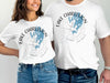 White t-shirts featuring a compass graphic with Lake Charleston and Ontario.