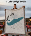 Man holding a blanket with a teal map of Lake Erie and "Ohio" text.