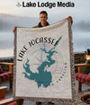 Man holding a blanket with a map of Lake Jocassee, South Carolina.