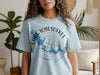 Light blue t-shirt with "Lake Tobesofkee Georgia" design and compass graphic.