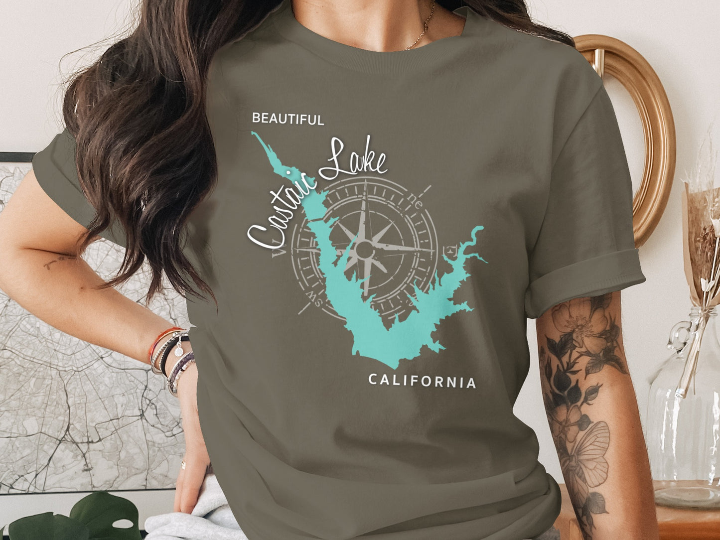 Olive green t-shirt with a stylized map of Castaic Lake, California and compass rose.
