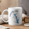 White mug with Falcon Lake Texas map and compass graphic, with steam rising.