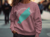 Pink sweatshirt with "Rattlesnake Lake Washington" text and a turquoise lake outline.