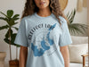 Light blue t-shirt with "Reelfoot Lake Tennessee" and map graphic.