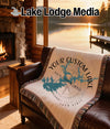 Custom lake-themed throw blanket with compass and lake outline designs.
