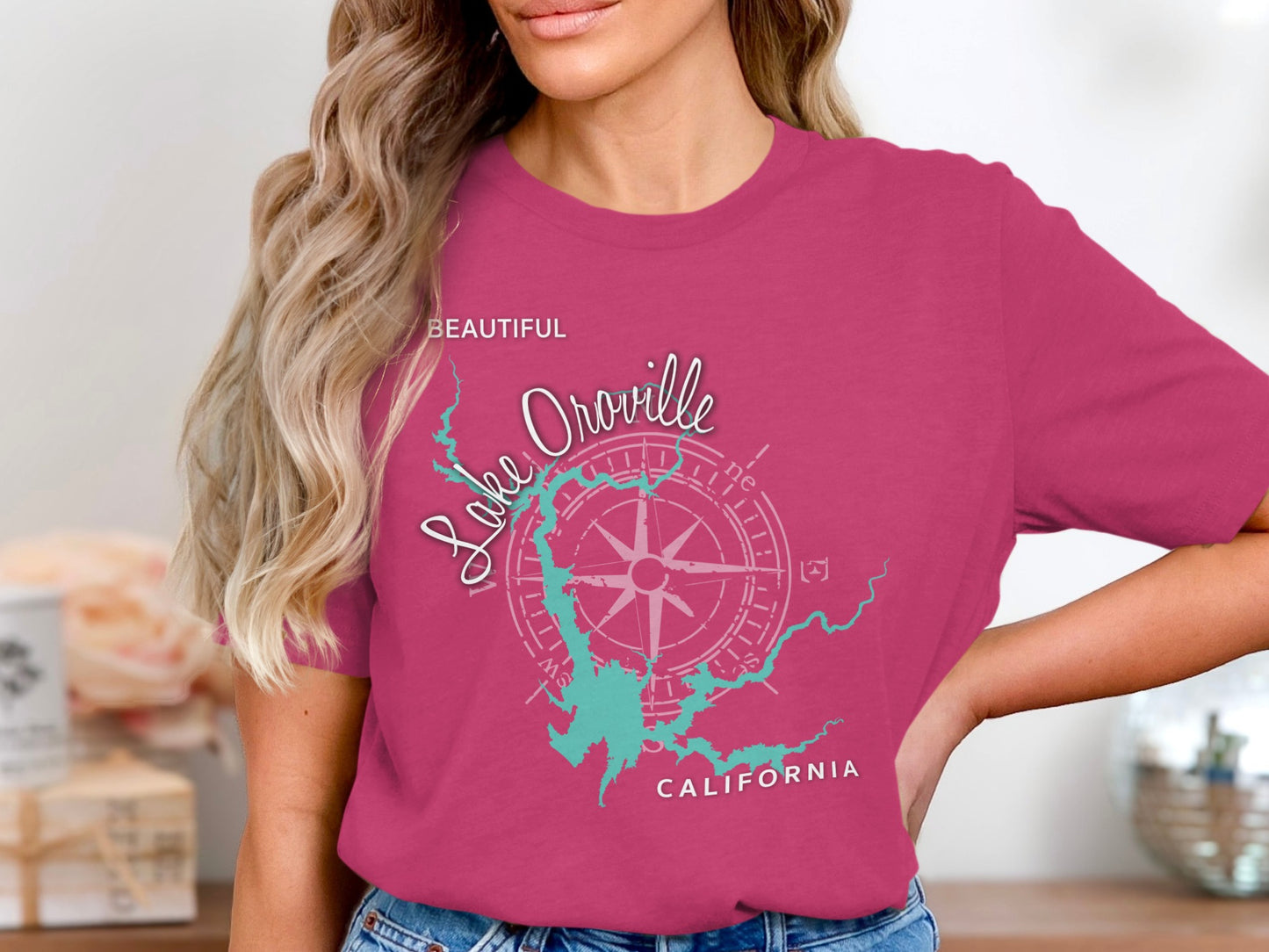 Pink t-shirt with Lake Oroville California graphic and compass rose.