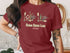 Maroon t-shirt with Cedar Creek Lake Texas and nautical graphics.