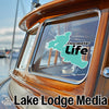 Clearwater Life logo on a boat window with Lake Lodge Media text below.