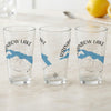 Three clear glasses with "Rainbow Lake Maine" text and a blue map illustration.