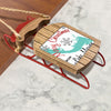 Miniature wooden sled ornament with red runners, reads "Merry Christmas From Lake Marion".